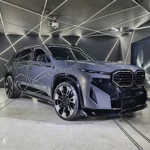 Grey BMW XM SUV in Showroom