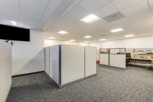 Office Space with Cubicles and Wooden Doors